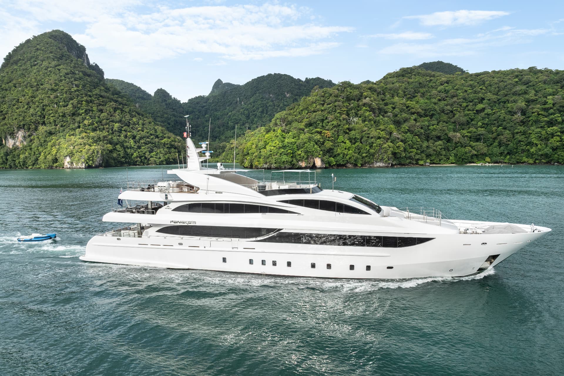 Phuket superyacht charter underway beside jungle-clad Andaman islands